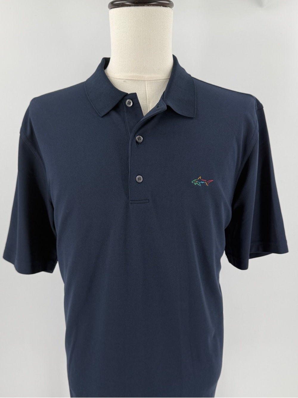 Greg Norman Collection Navy Polo with Multicolor Shark Accent